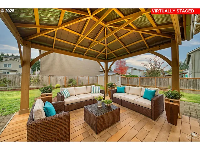 a outdoor living space with patio furniture and garden view
