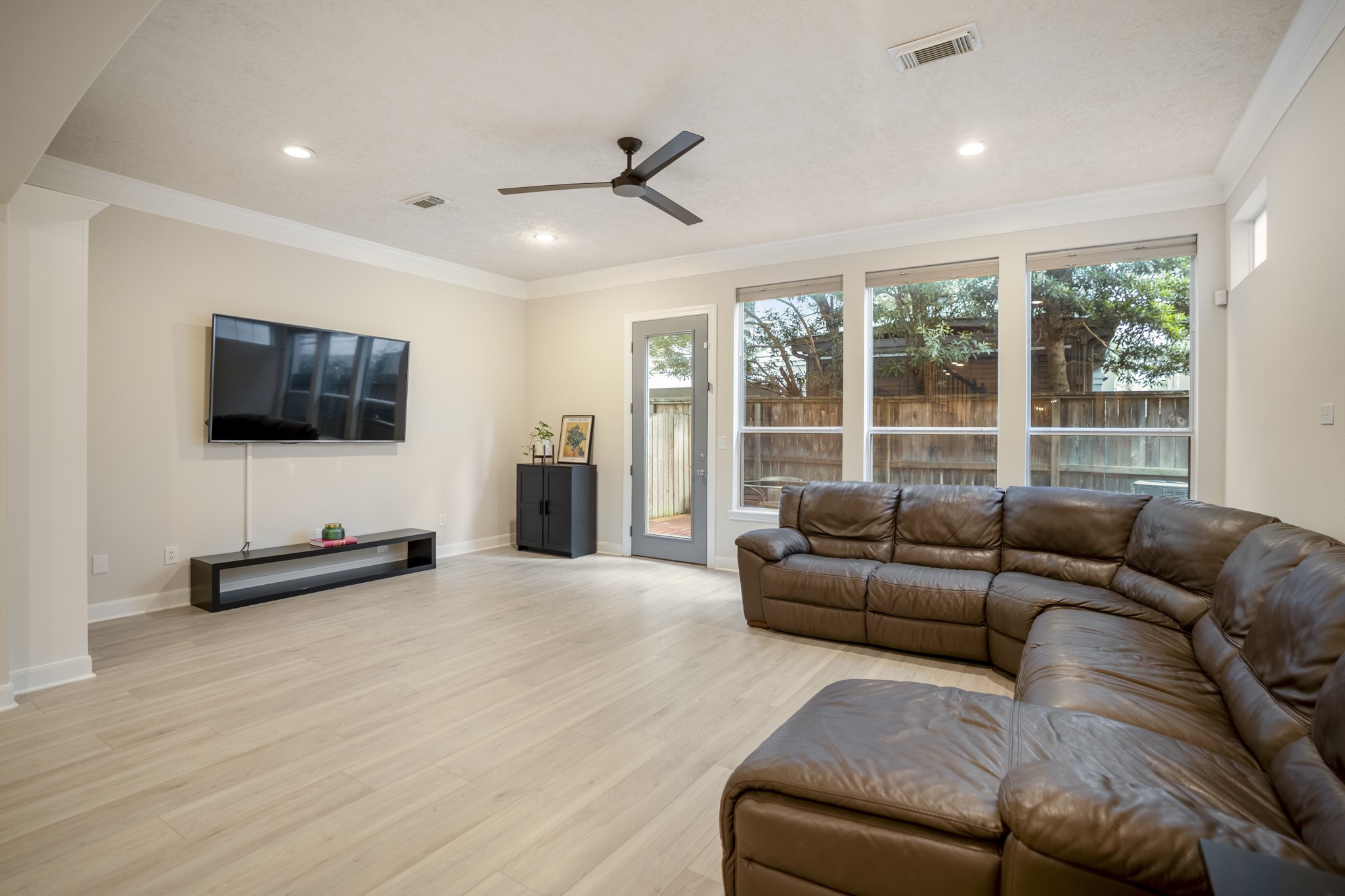4236 Drake Street Houston, TX 77005 - Photo 12 of 43 Inviting living room showcasing new paint and updated flooring completed in 2024.