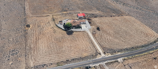 1061 Copper Street Stockton, UT 84071 - Photo 43 of 43 Aerial perspective showcasing a property with a primary residence, an auxiliary building, and extensive surrounding land