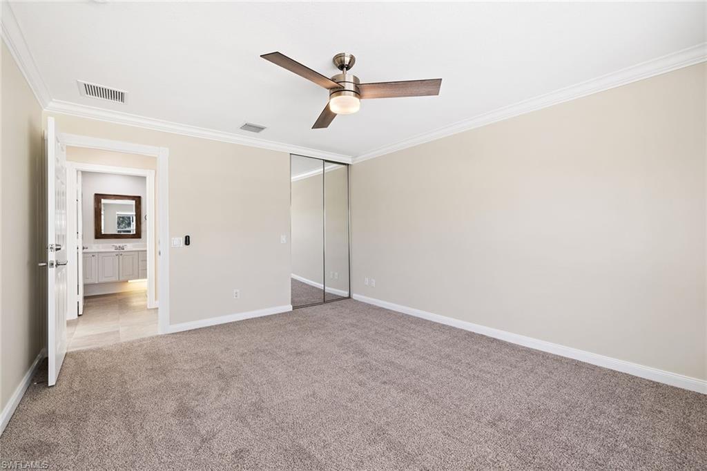 7539 Novara Court Naples, FL 34114 - Photo 17 of 30 a view of a big room with closet and windows