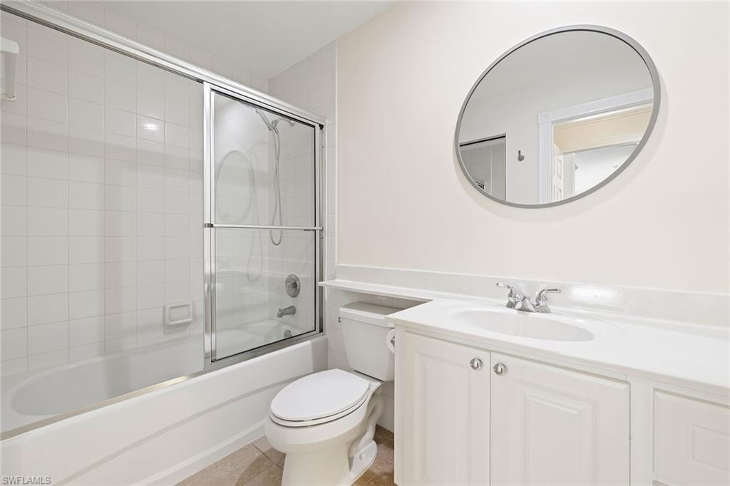 7539 Novara Court Naples, FL 34114 - Photo 18 of 30 a bathroom with a sink toilet and shower