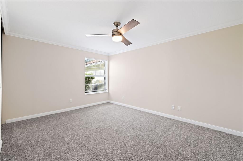 7539 Novara Court Naples, FL 34114 - Photo 19 of 30 a view of empty room with window and ceiling fan
