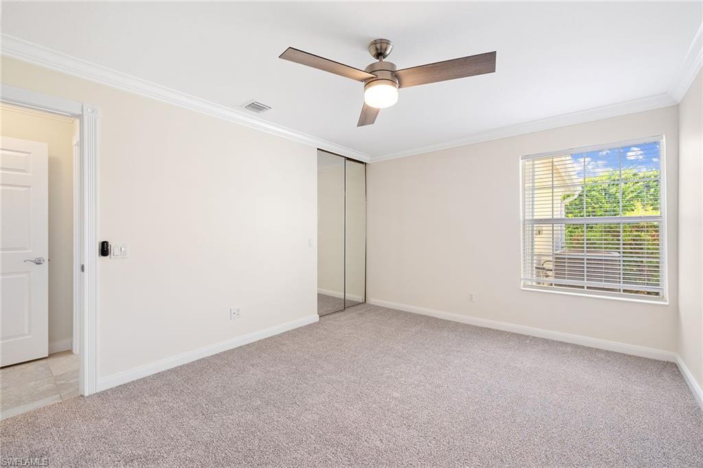 7539 Novara Court Naples, FL 34114 - Photo 20 of 30 a view of an empty room with a window