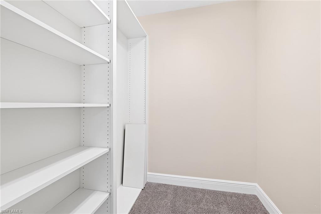 7539 Novara Court Naples, FL 34114 - Photo 21 of 30 a view of an empty walk in closet
