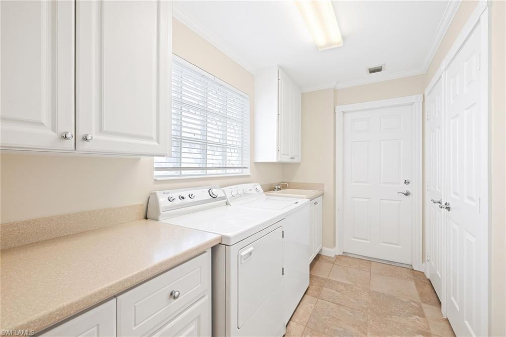 7539 Novara Court Naples, FL 34114 - Photo 22 of 30 a kitchen with a sink and cabinets