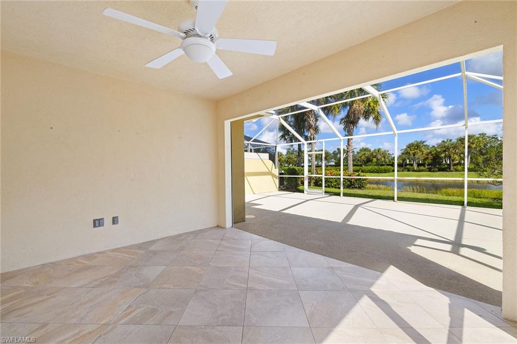 7539 Novara Court Naples, FL 34114 - Photo 24 of 30 a view of a house with a porch and a floor to ceiling window