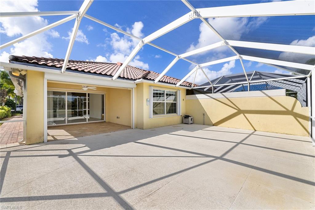 7539 Novara Court Naples, FL 34114 - Photo 27 of 30 a view of a hall with wooden floor and a window