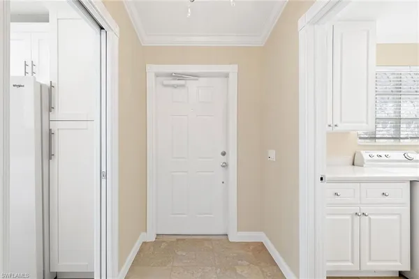 a view of hallway with wooden floor