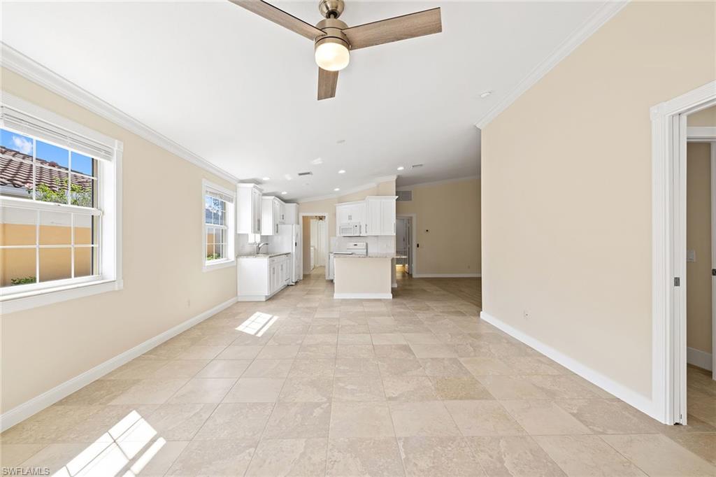 7539 Novara Court Naples, FL 34114 - Photo 7 of 30 a view of a livingroom with a workspace