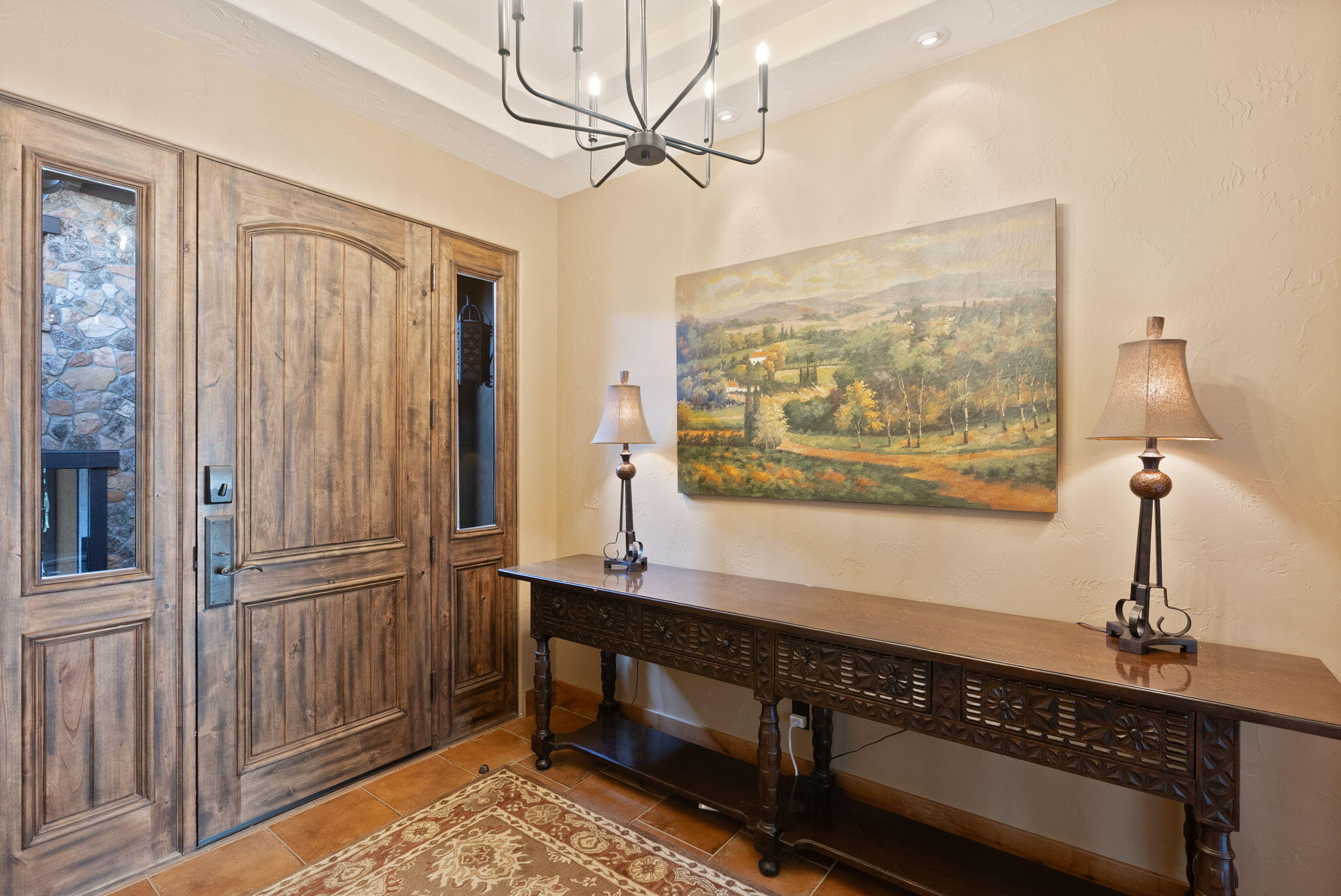 22887 Ghost Tree Lane Bend, OR 97701 - Photo 10 of 97 A grand foyer greets with recessed ceiling, updated chandelier and French doors opening to the courtyard