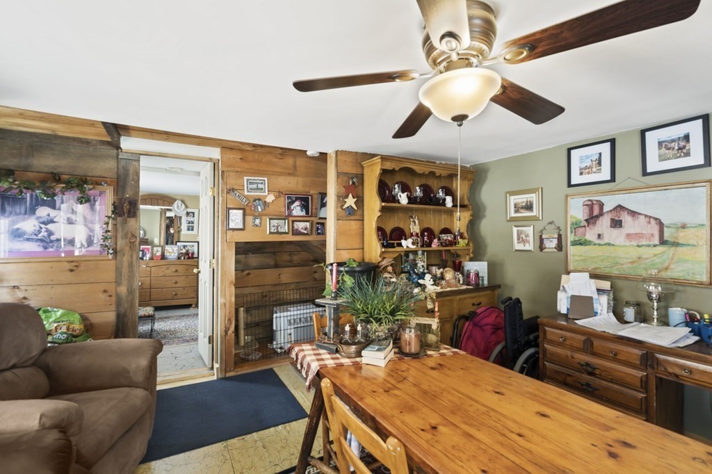 477 Podunk Road East Brookfield, MA 01515 - Photo 8 of 29 a view of a livingroom with furniture and a chandelier fan