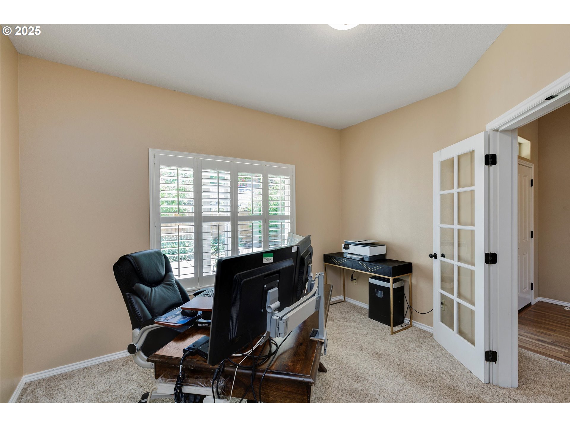 125 Telford Road Oregon City, OR 97045 - Photo 13 of 42 a view of a workspace with furniture and a window