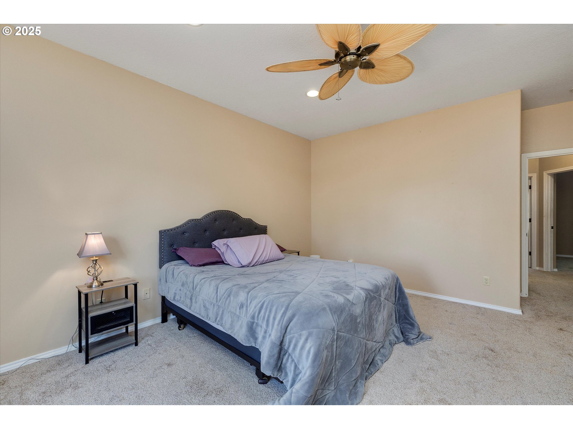 125 Telford Road Oregon City, OR 97045 - Photo 24 of 42 a bedroom with a bed and a chandelier
