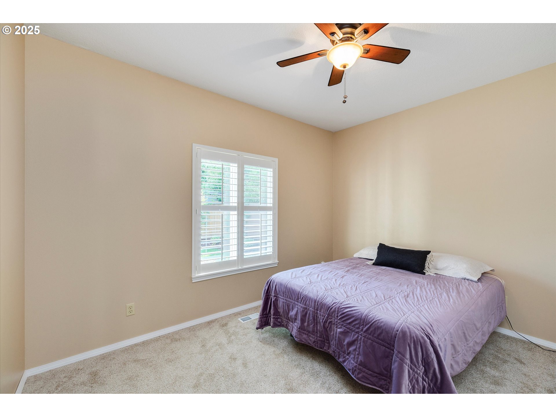 125 Telford Road Oregon City, OR 97045 - Photo 28 of 42 a bedroom with a bed and a chandelier