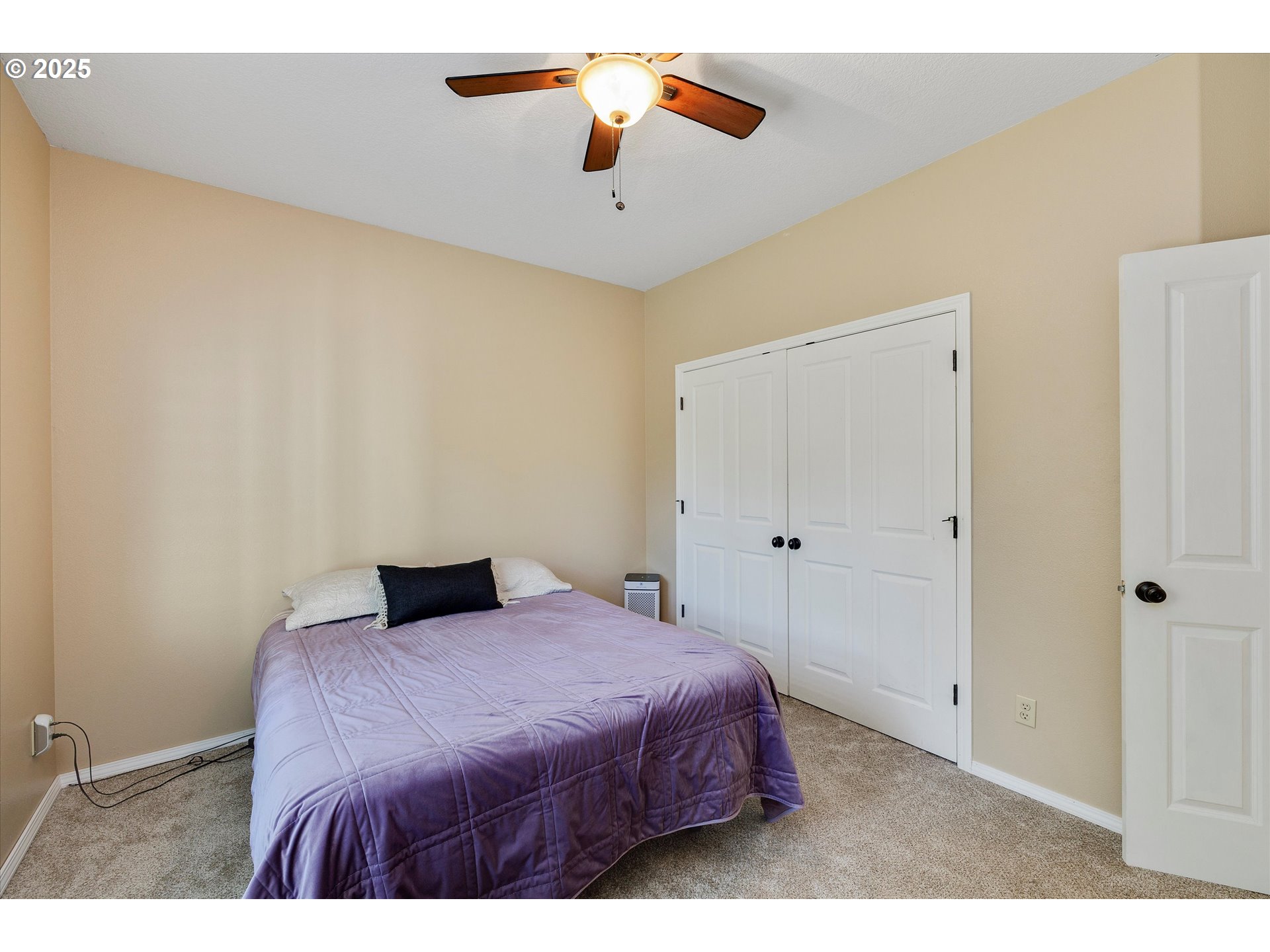 125 Telford Road Oregon City, OR 97045 - Photo 29 of 42 a bedroom with a bed and a chandelier
