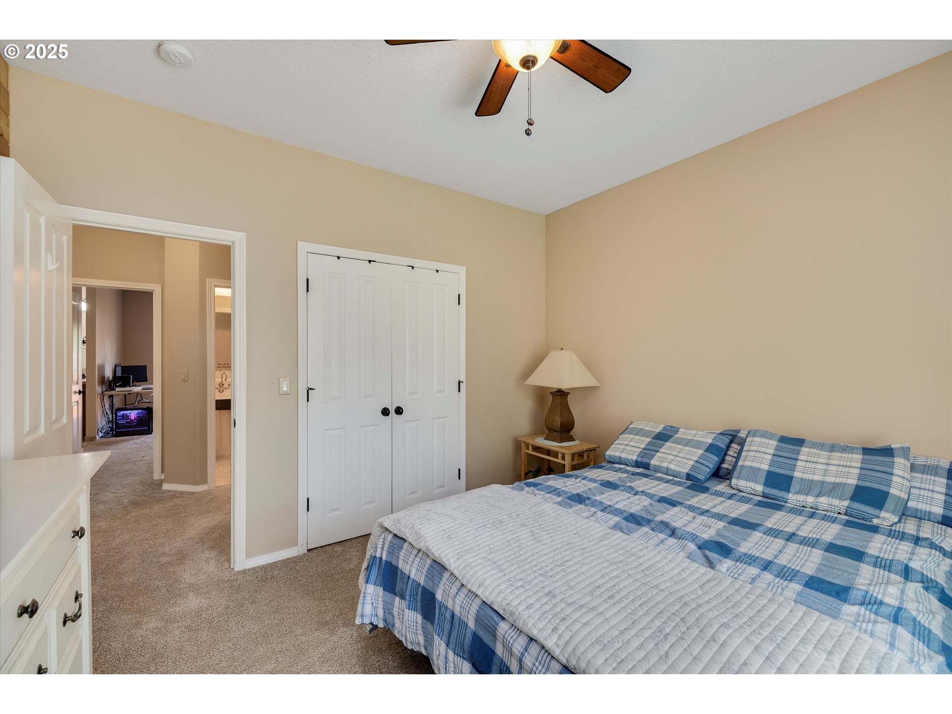 125 Telford Road Oregon City, OR 97045 - Photo 32 of 42 a bedroom with a bed and a chandelier
