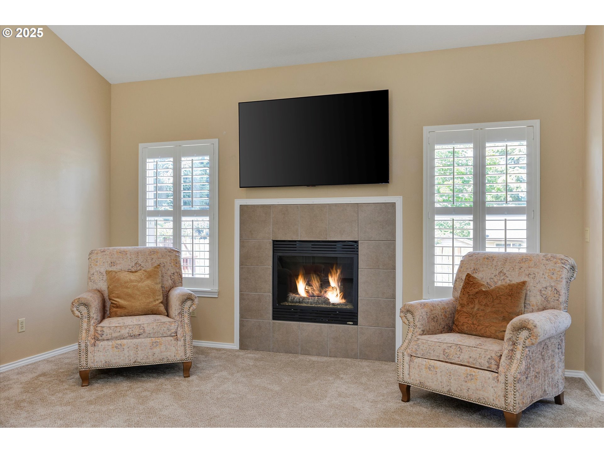 125 Telford Road Oregon City, OR 97045 - Photo 10 of 42 a living room with furniture a flat screen tv and a fireplace