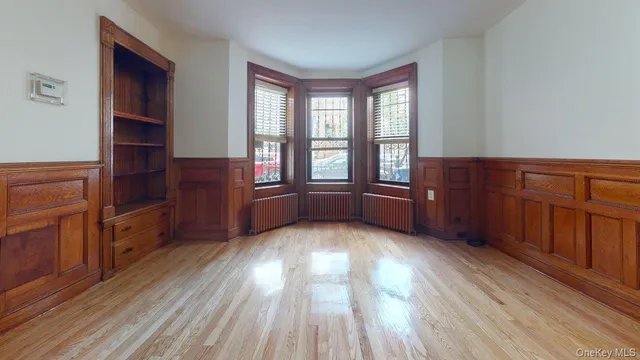 a view of wooden floor and windows in a room