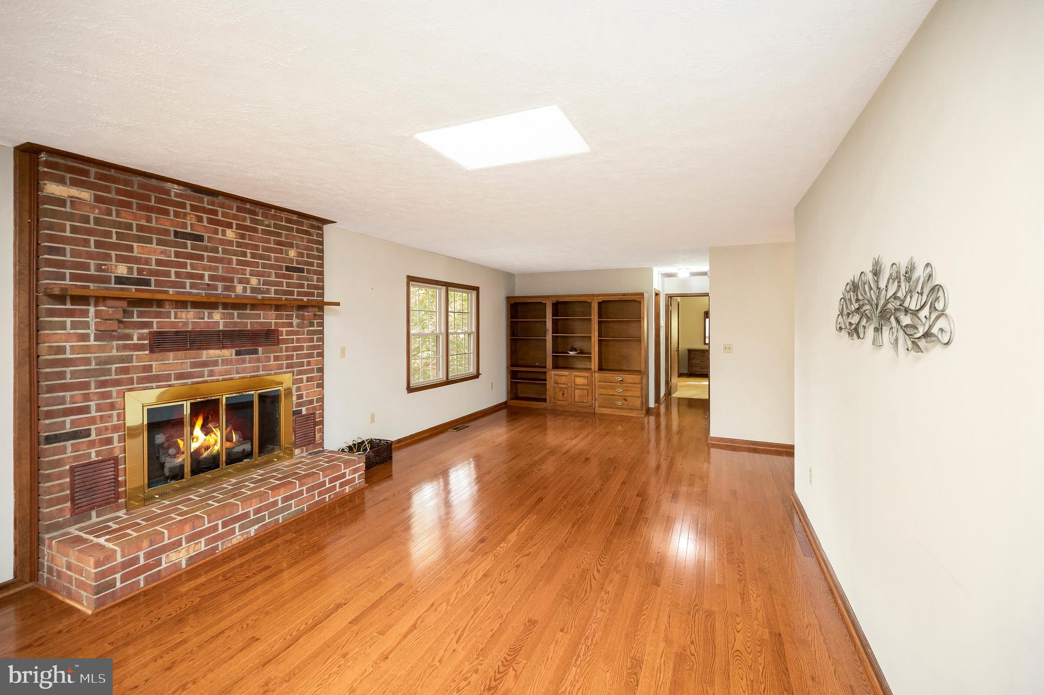 104 Appleview Court Locust Grove, VA 22508 - Photo 8 of 65 a view of a livingroom with wooden floor and a fireplace