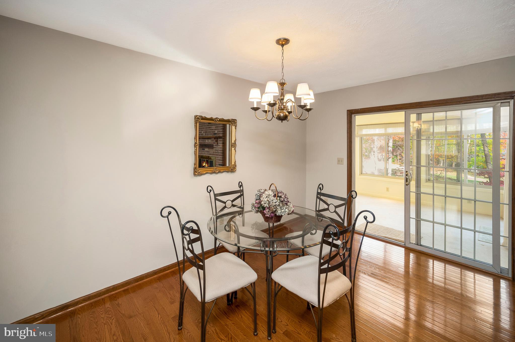 104 Appleview Court Locust Grove, VA 22508 - Photo 10 of 65 a view of a dining room with furniture a chandelier and wooden floor