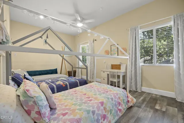 a bedroom with bed and a chandelier