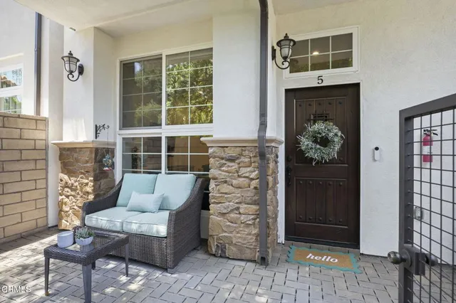 a living room with furniture and entry gate