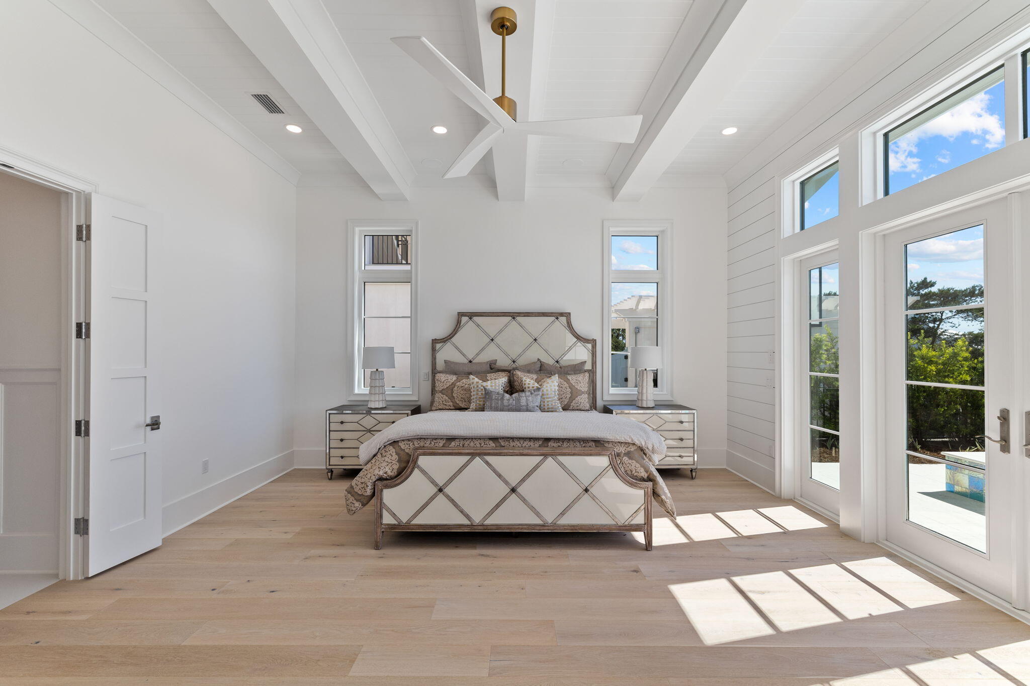 45 Emerald Ridge Santa Rosa Beach, FL 32459 - Photo 21 of 58 a spacious bedroom with a bed and a mirror