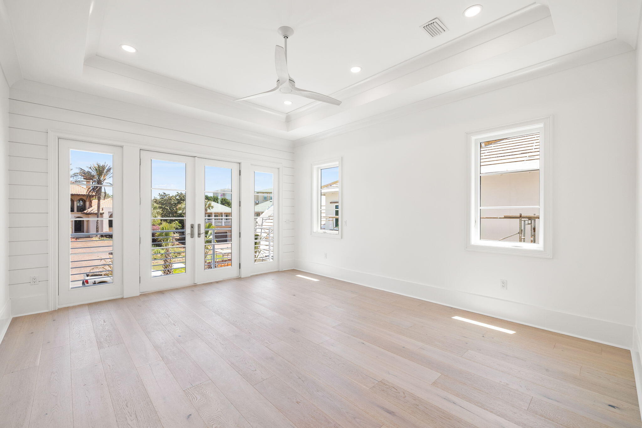 45 Emerald Ridge Santa Rosa Beach, FL 32459 - Photo 34 of 58 an empty room with wooden floor chandelier and windows
