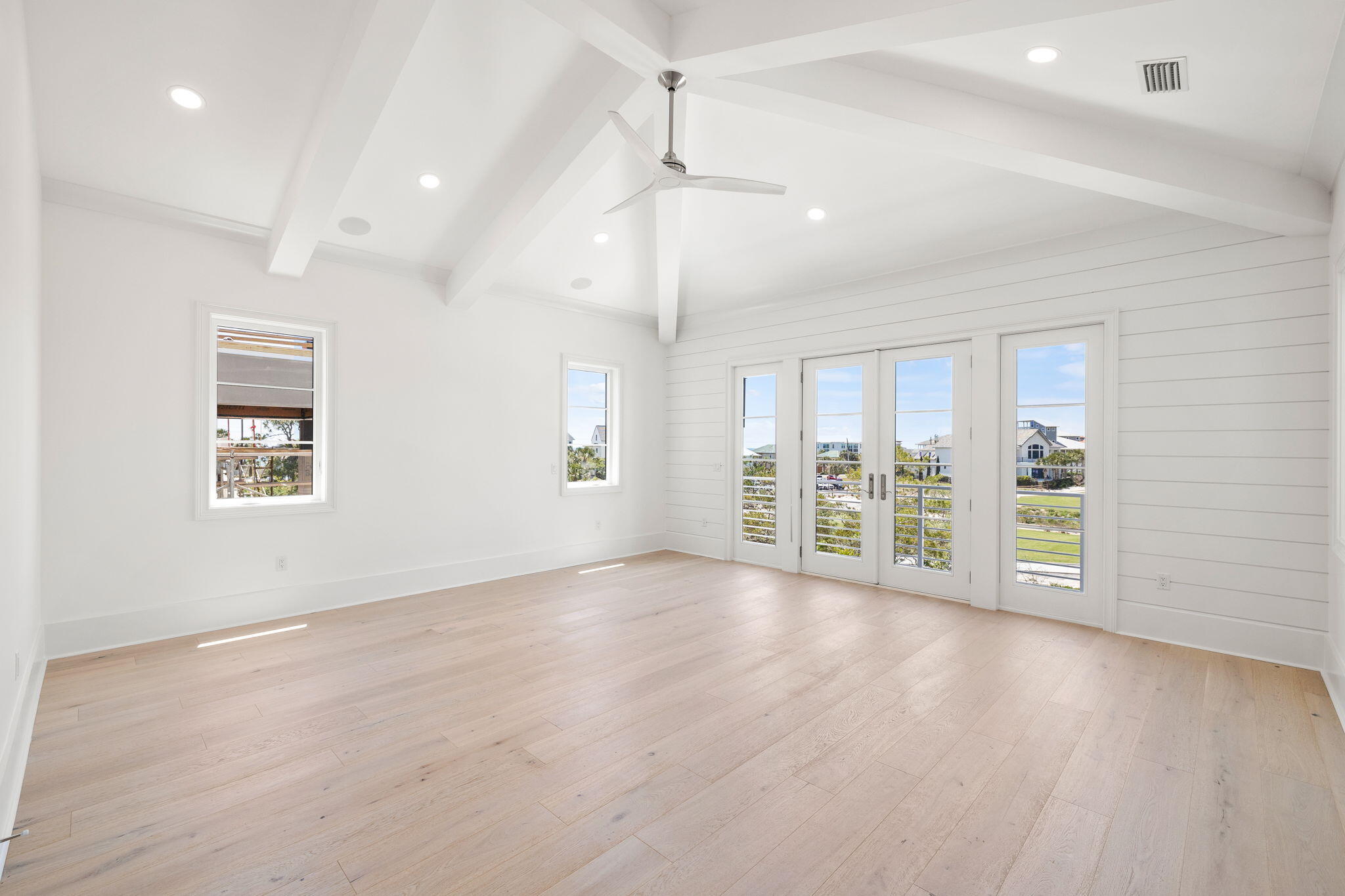 45 Emerald Ridge Santa Rosa Beach, FL 32459 - Photo 38 of 58 an empty room with wooden floor and windows
