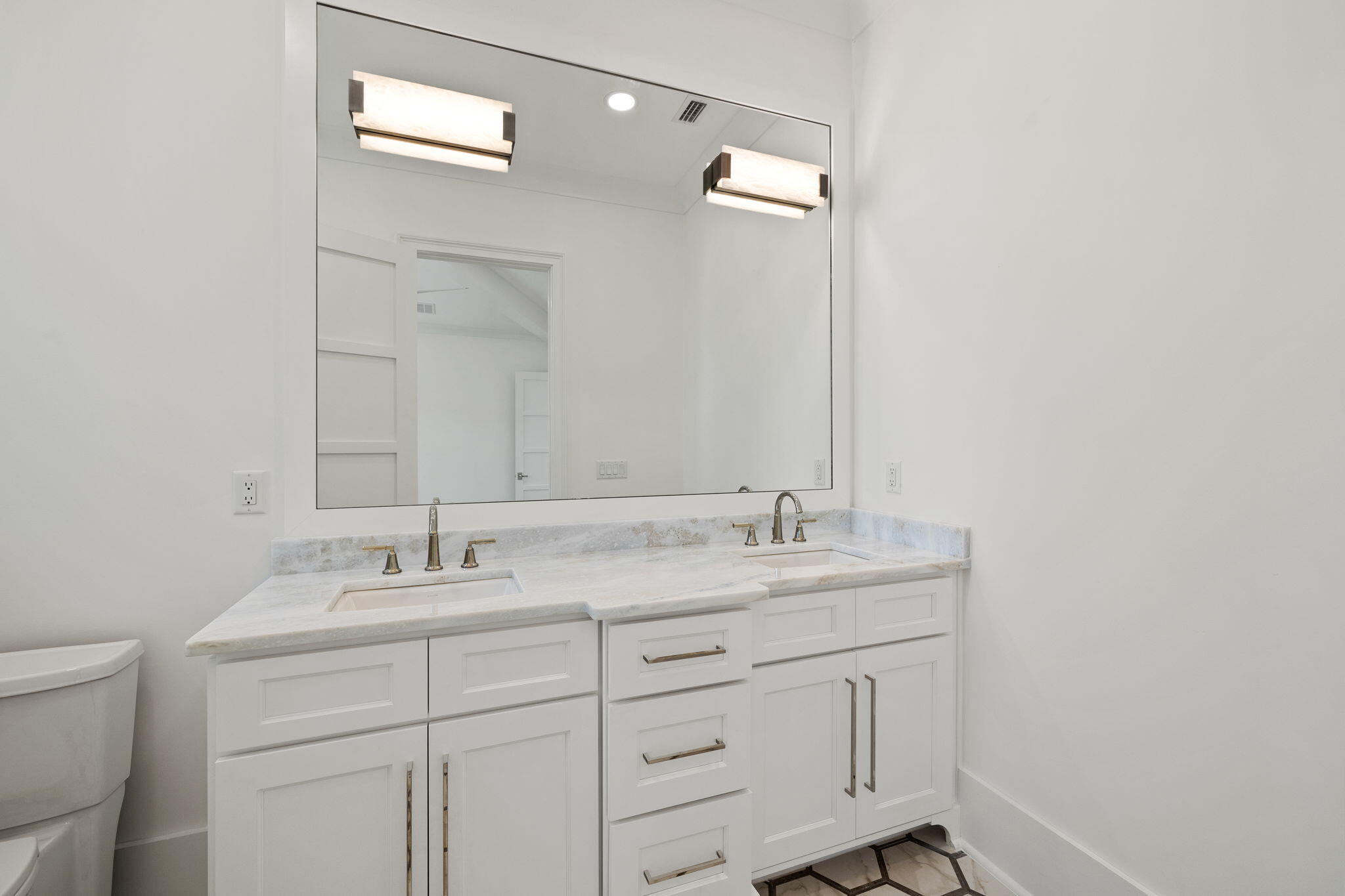 45 Emerald Ridge Santa Rosa Beach, FL 32459 - Photo 44 of 58 a bathroom with a sink vanity granite and a mirror