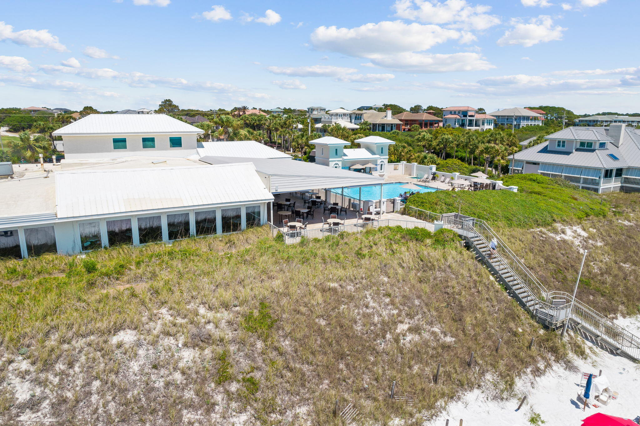 45 Emerald Ridge Santa Rosa Beach, FL 32459 - Photo 53 of 58 a view of a white house with a big yard and large trees
