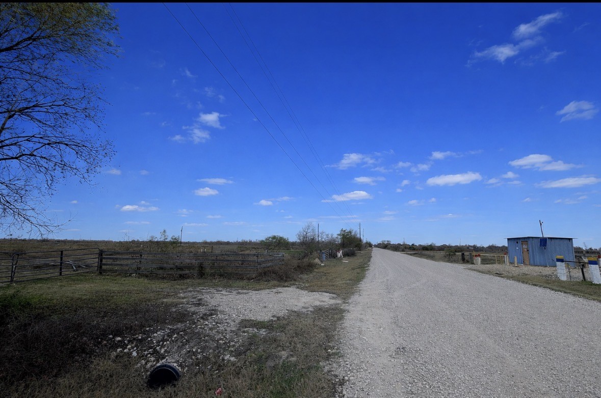14602 Hughes Road Guy, TX 77444 - Photo 5 of 8 a view of a dry yard with wooden fence