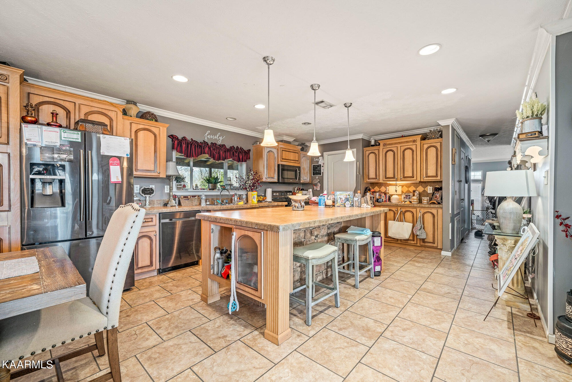 1037 Austin Road Sparta, TN 38583 - Photo 32 of 32 a kitchen with stainless steel appliances kitchen island granite countertop a stove and cabinets