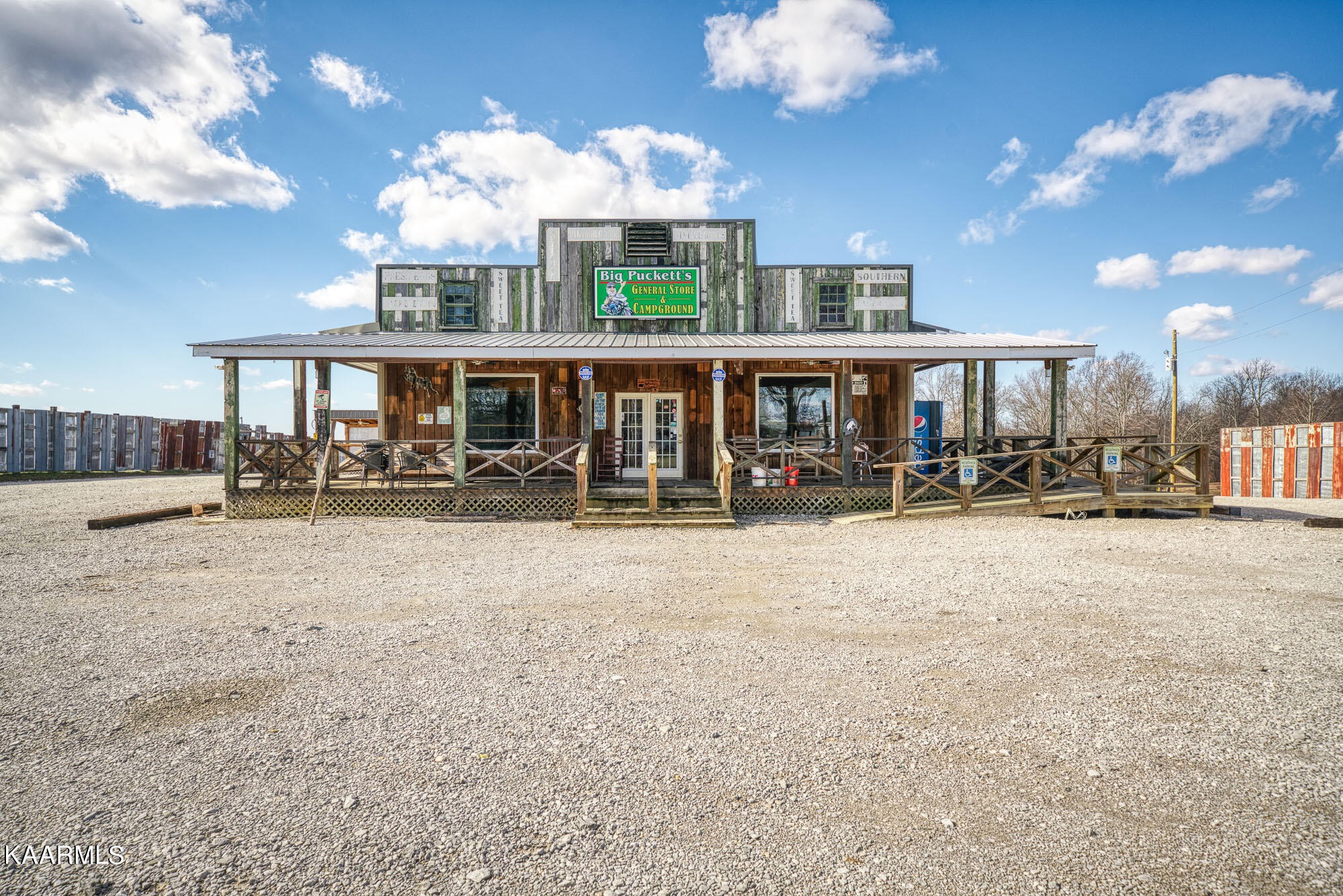1037 Austin Road Sparta, TN 38583 - Photo 4 of 32 a front view of a house with a yard and outdoor seating