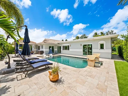 a workspace with wooden floor and a window
