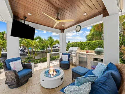 a view of a patio with a table and chairs