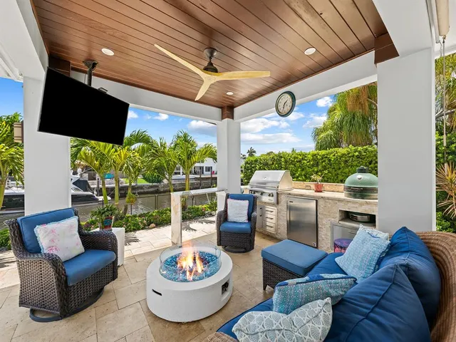 a view of a patio with a table and chairs