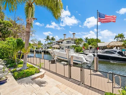 a front view of a house with a garden and yard