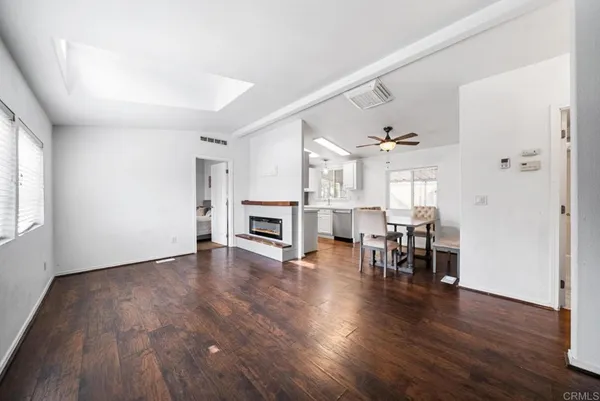 a view of dining room with furniture and wooden floor