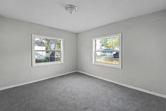 an empty room with windows