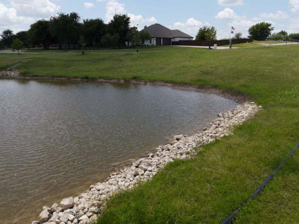3322 Mariposa Ridge Crowley, TX 76036 - Photo 16 of 34 a view of a golf course with a lake