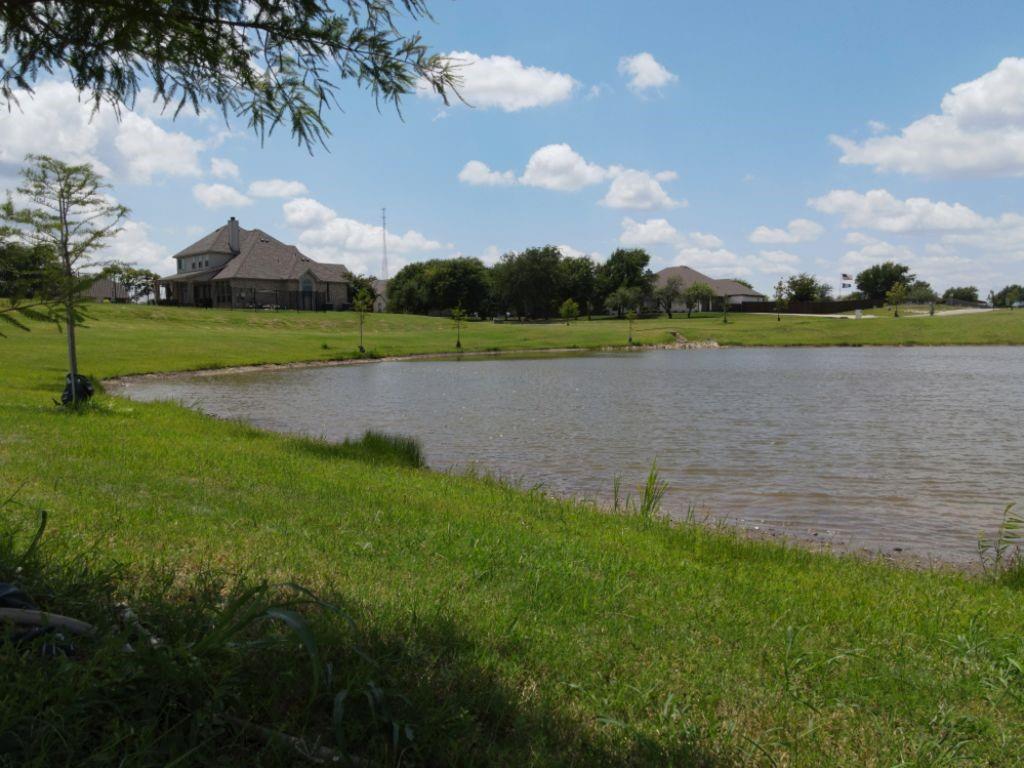 3322 Mariposa Ridge Crowley, TX 76036 - Photo 17 of 34 a view of a lake with green field