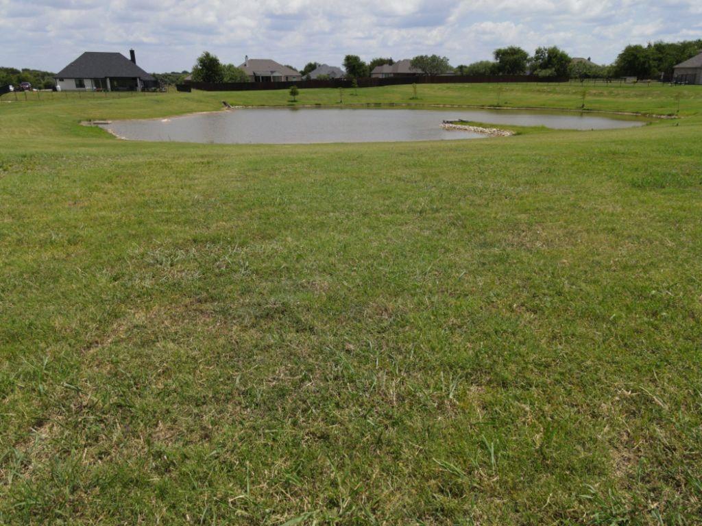 3322 Mariposa Ridge Crowley, TX 76036 - Photo 23 of 34 a view of a field with houses in the background