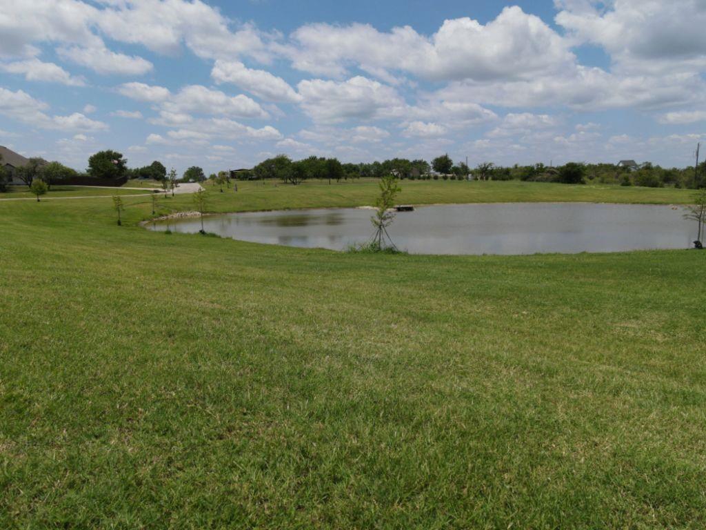 3322 Mariposa Ridge Crowley, TX 76036 - Photo 32 of 34 a view of a lake with houses in the back