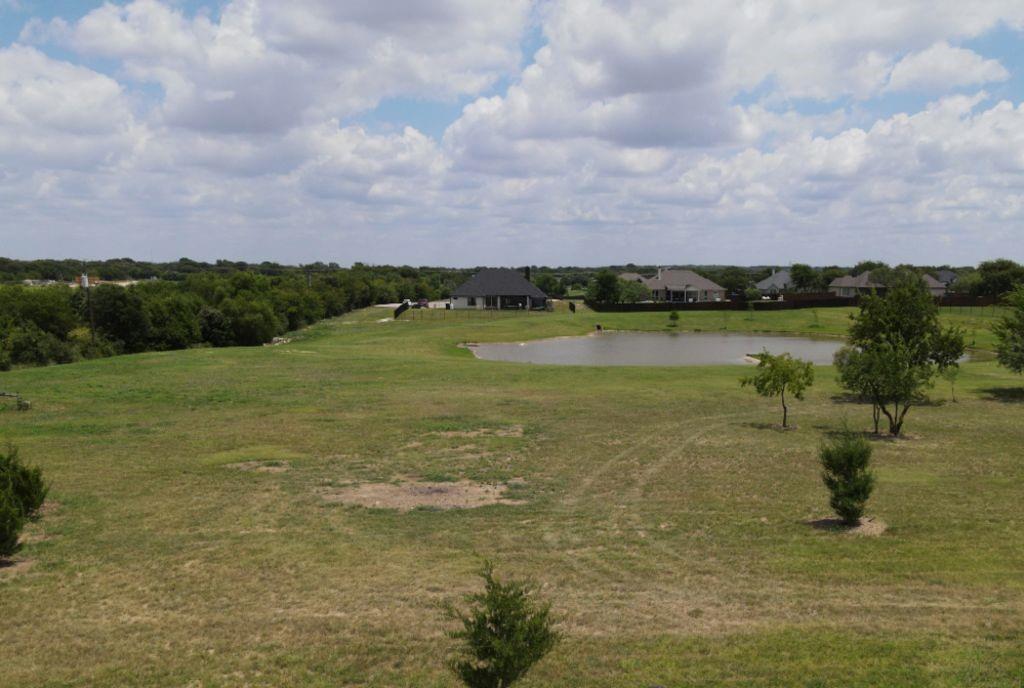 3322 Mariposa Ridge Crowley, TX 76036 - Photo 6 of 34 a view of a lake with a mountain in the background