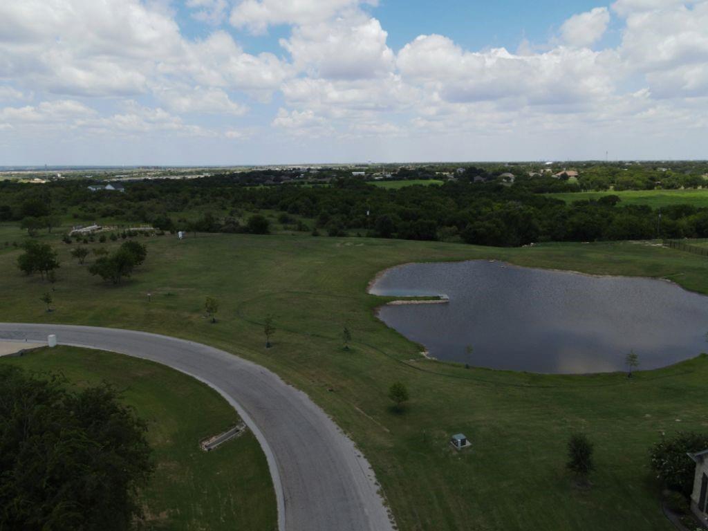 3322 Mariposa Ridge Crowley, TX 76036 - Photo 9 of 34 a view of a lake with a yard