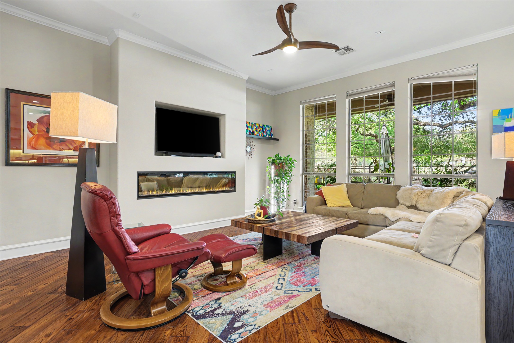 805 Boquilla Trail Georgetown, TX 78633 - Photo 10 of 40 a living room with furniture a flat screen tv and a large window