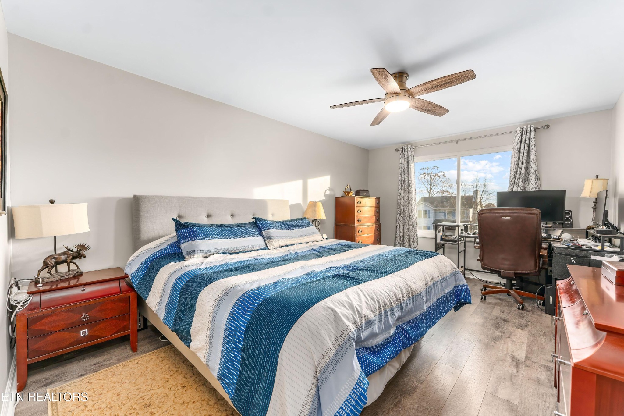 1935 Poplar Hill Road Knoxville, TN 37922 - Photo 12 of 25 a bedroom with bed and a chandelier