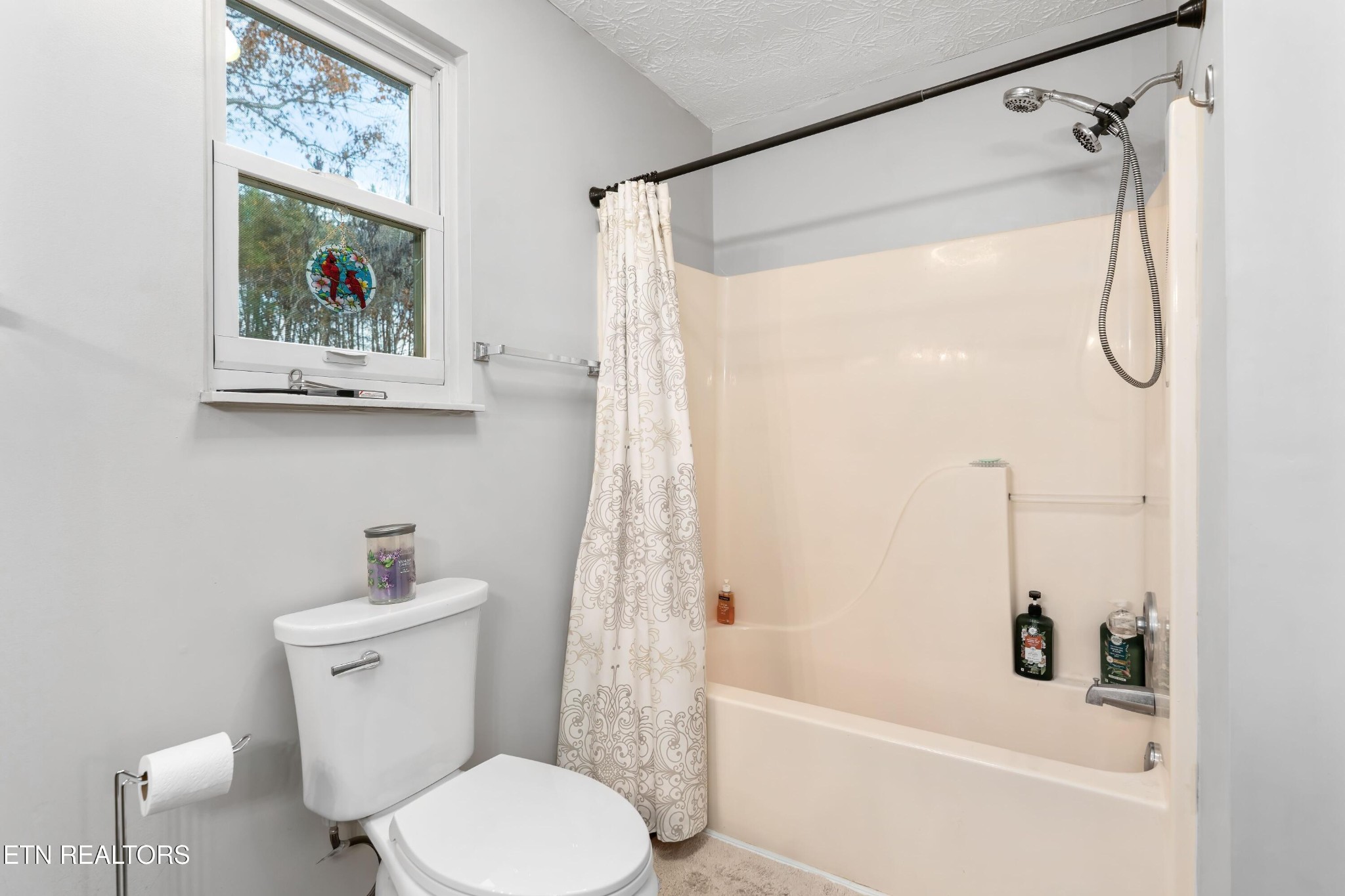 1935 Poplar Hill Road Knoxville, TN 37922 - Photo 14 of 25 a bathroom with a toilet and a shower