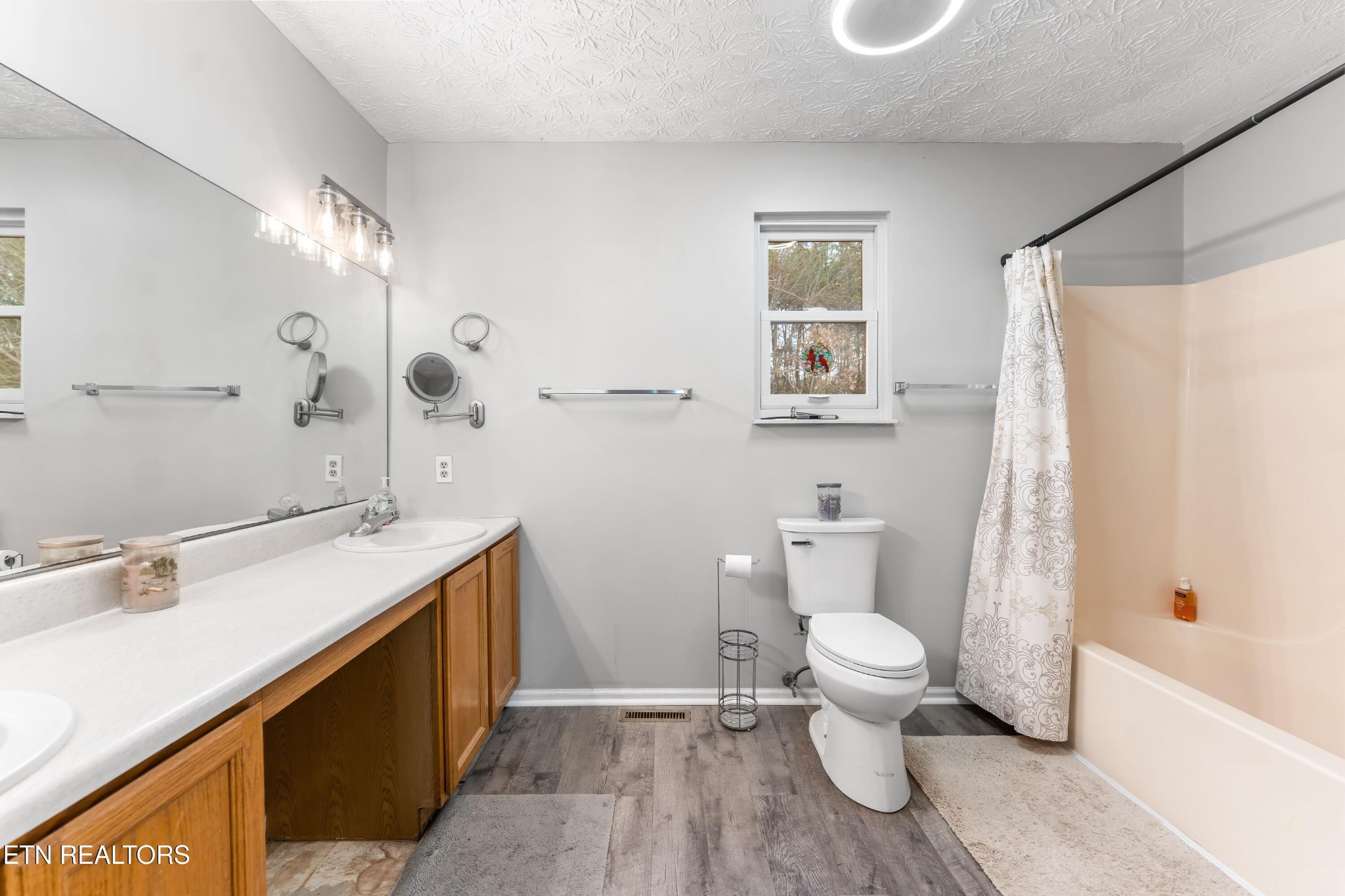 1935 Poplar Hill Road Knoxville, TN 37922 - Photo 15 of 25 a bathroom with a sink toilet and a mirror